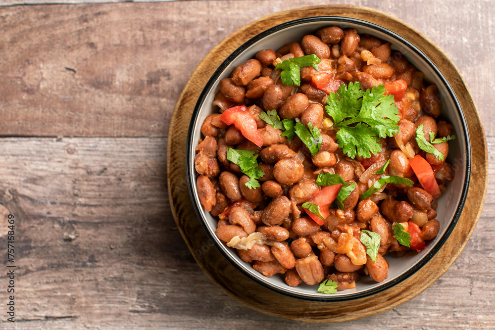Vegetarian dish of stewed pink beans and tomatoes. A delicious bean dish served Vegetarian dish of stewed pink beans and tomatoes. A delicious bean dish served