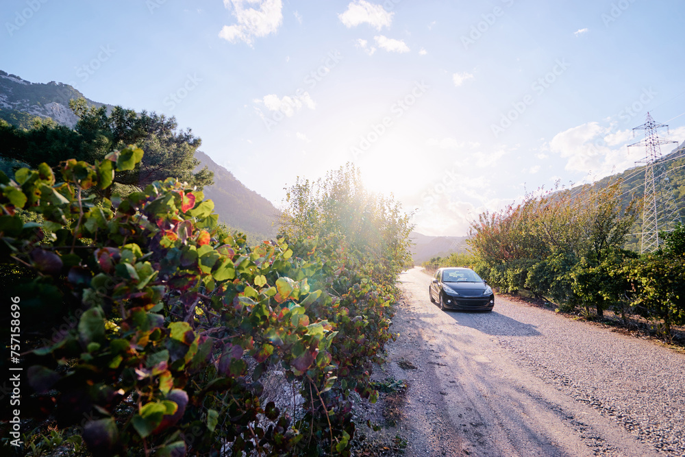 Beautiful landscape with car on road against mountains. Beautiful landscape with car on road against mountains.