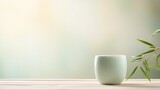 Product photo, delicate celadon porcelain teacup, soft colours, bamboo environment, minimalism, dreamy ethereal bokeh background 