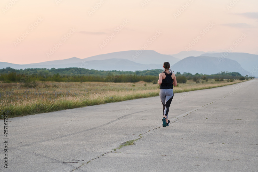 Solo Stride: Determined Athlete Woman Embarks on Fitness Journey for Marathon Preparation. Solo Stride: Determined Athlete Woman Embarks on Fitness Journey for Marathon Preparation.