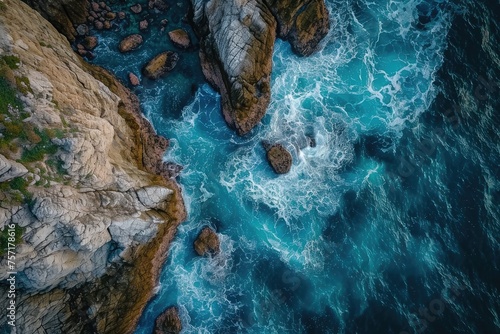 Experience the awe-inspiring beauty of the boundless ocean and rugged rocks in this stunning aerial photograph, A mesmerizing aerial display of a sea dancing around the rocky beach, AI Generated
