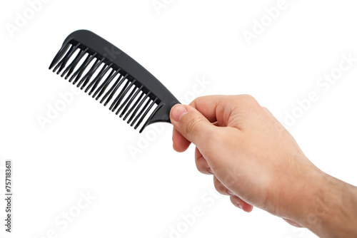 Male Hand Holding A Black Hair Comb