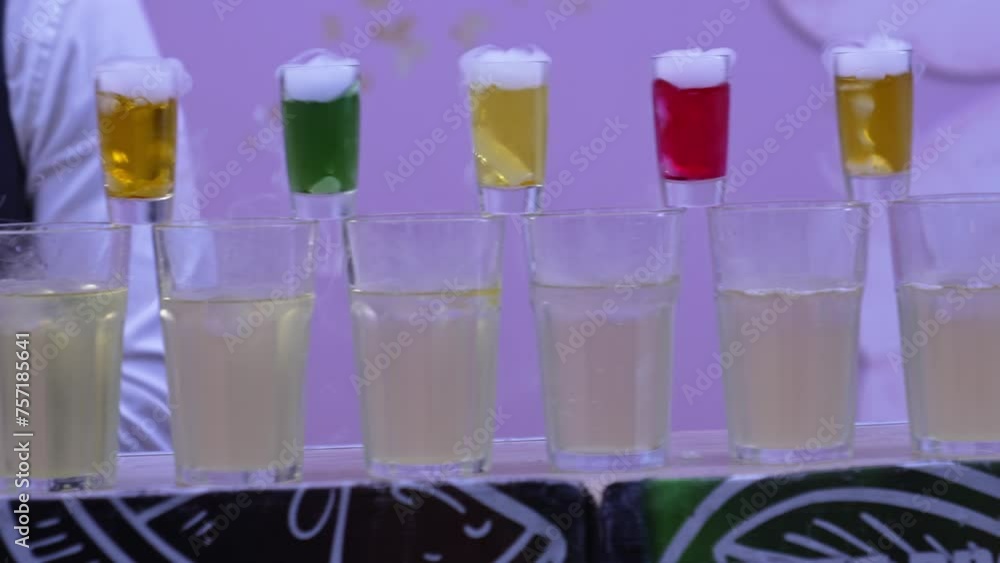 Bartender show. Preparation of cocktails with colorful drinks and dry ice. Entertainment at the banquet. Bartender show. Preparation of cocktails with colorful drinks and dry ice. Entertainment at the banquet.