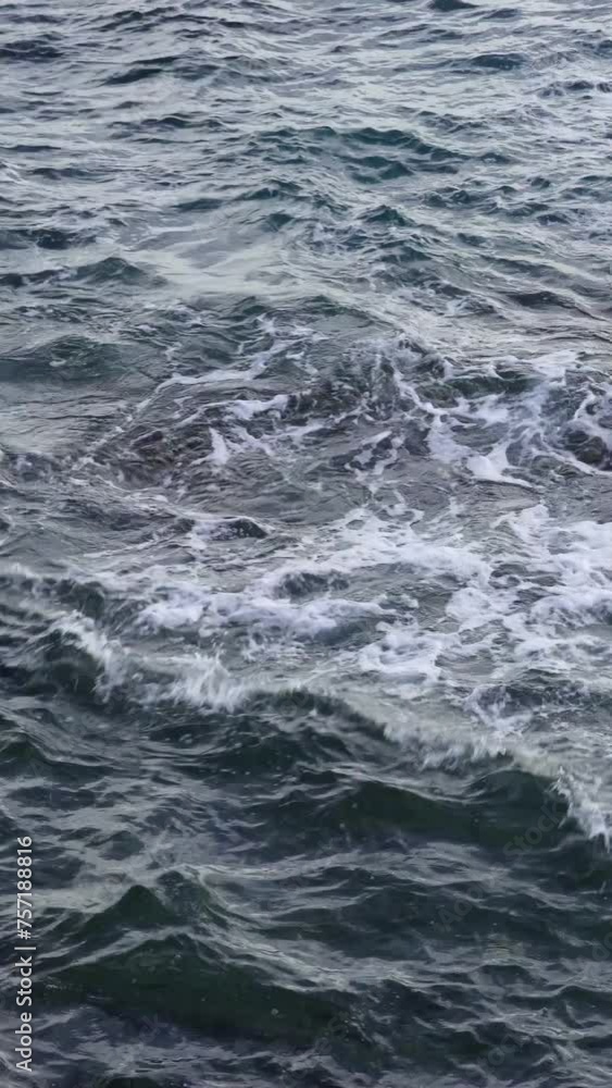 Close-up calm ocean water surface on submerged rocks Close-up calm ocean water surface on submerged rocks