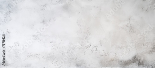 A close up of a grey marble flooring texture with cumulus clouds in the background, resembling a snowy natural landscape in monochrome photography