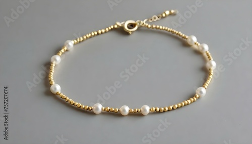 A Delicate Pearl Bracelet Accented With Tiny Gold
