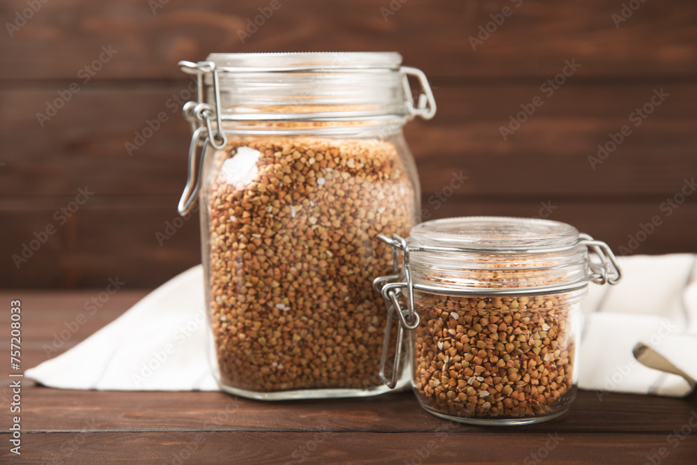 Green buckwheatin on a wooden kitchen table.Superfood.Raw buckwheat porridge.Healthy vegan food concept, eco products, diet. Copy space.Organic food.weight loss and proper nutrition. Green buckwheatin on a wooden kitchen table.Superfood.Raw buckwheat porridge.Healthy vegan food concept, eco products, diet. Copy space.Organic food.weight loss and proper nutrition.