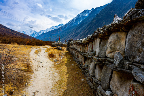 Traditional Stone Mani Wall on the Trekking Path from Mundu to Kyanjin Gompa, Langtang Valley, Nepal