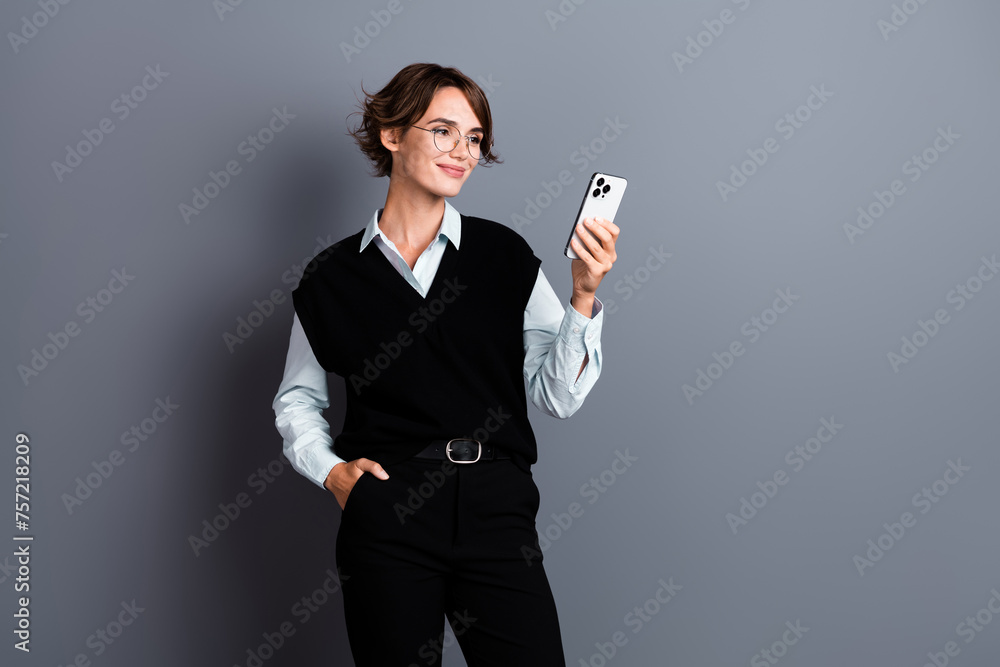 Photo of stunning nice lady dressed stylish clothes reading email letter post respost isolated on gray color background Photo of stunning nice lady dressed stylish clothes reading email letter post respost isolated on gray color background
