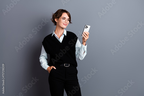 Photo of stunning nice lady dressed stylish clothes reading email letter post respost isolated on gray color background © deagreez