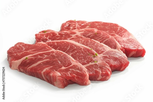 Pristine white background showcases beautifully arranged pieces of fresh beef