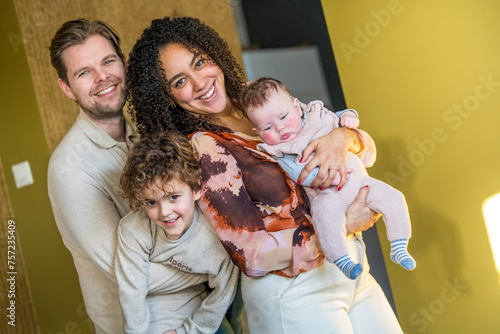 Happy family posing for a cozy portrait at home. photo
