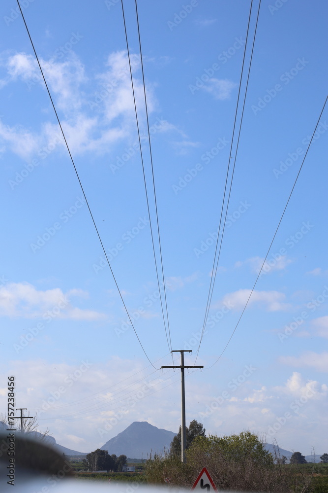 power lines on a cloudy sky