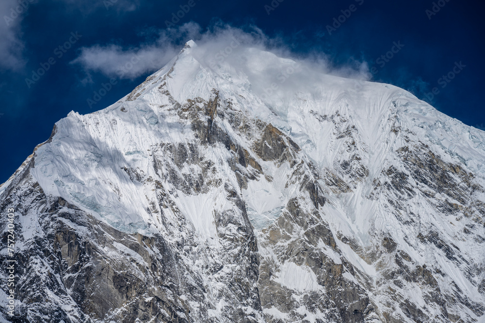 Majestic Summit of a Snow-Covered Peak in Langtang National Park, Nepal Majestic Summit of a Snow-Covered Peak in Langtang National Park, Nepal