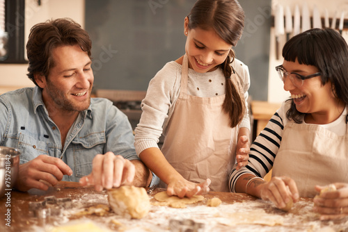 Mother, father and girl with dough for cooking in kitchen with flour, happiness and teaching with support. Family, parents and child with helping, learning and bonding with baking for snack and hobby