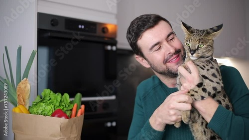 Cute video of man kissing his cat  photo