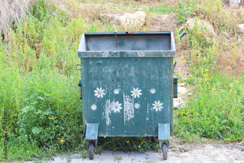municipal metal garbage bin in the street © UMIT
