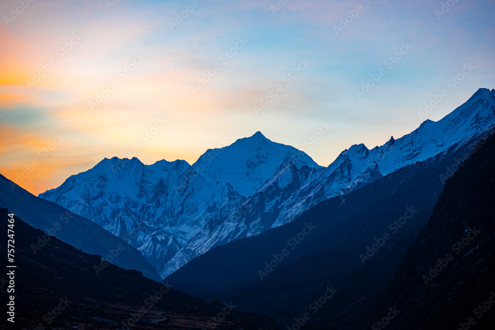 Alpenglow Splendor: Sunset Over the Snow-Capped Peaks of Langtang, Nepal