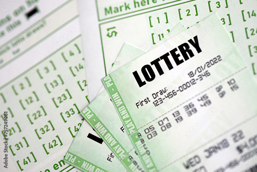 Green lottery tickets and blank bills with numbers for playing lottery close up Green lottery tickets and blank bills with numbers for playing lottery close up