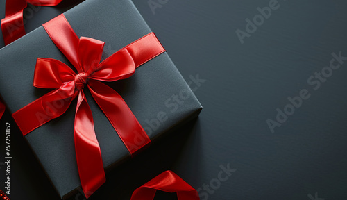 Close up black gift on black background with copyspace. Valentine's day, black friday, romance, love, wedding anniversary concept 