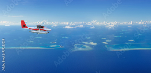 Seaplane flies over Maldives island