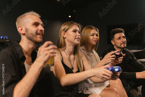 Men watch women showing finesse tackling challenges in console games. Ladies demonstrate console gaming expertise during party with boyfriends