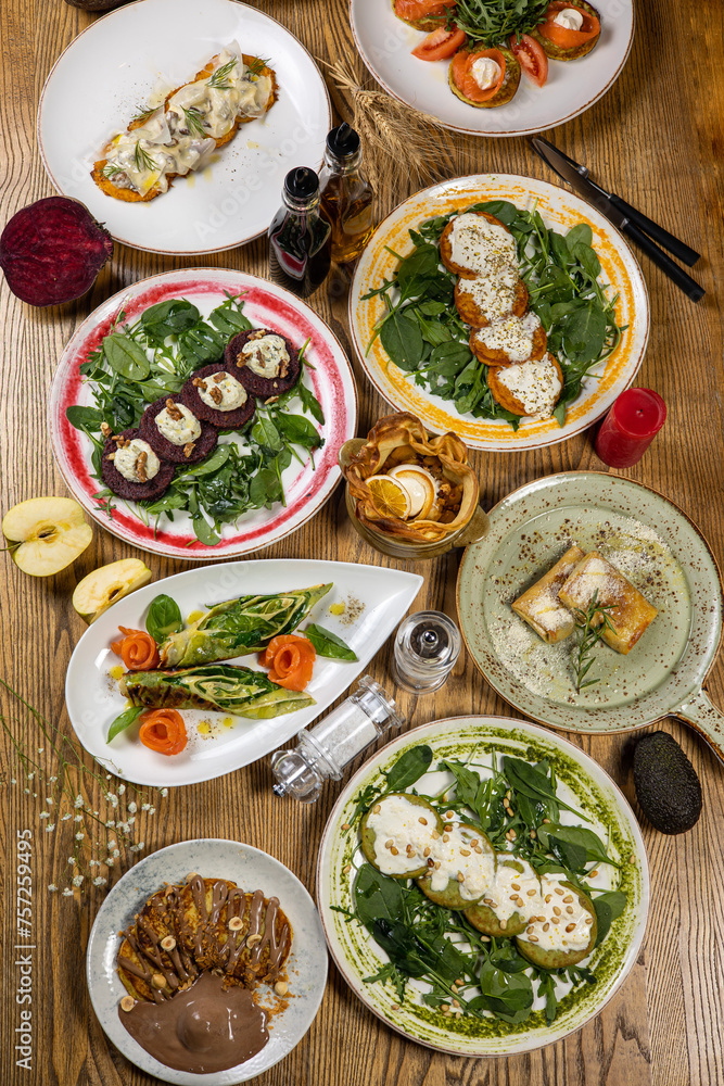 Selection of healthy vegetarian dishes with spinach, feta cheese, pumpkin and beetroot