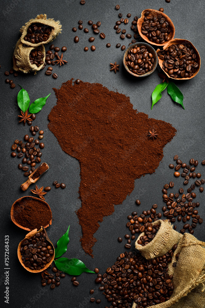 The concept of coffee from Brazil or South America. Fragrant roasted Robusta or Arabica coffee. Top view. On a black stone table.