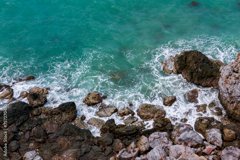 high-angle landscape of rocks by the sea The view from the mountain in the island with the cool breeze, green trees and the blue sea. The air is nice and refreshing in the summer in Thailand. high-angle landscape of rocks by the sea The view from the mountain in the island with the cool breeze, green trees and the blue sea. The air is nice and refreshing in the summer in Thailand.