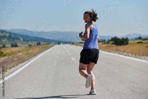 A determined woman athlete trains for success in the morning sun.