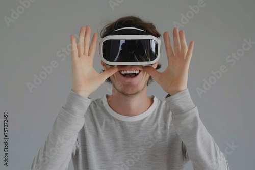 Enthusiastic user experiencing virtual reality technology with reflective headset. A person wearing a virtual reality headset with a reflective surface showing a hand gesture.