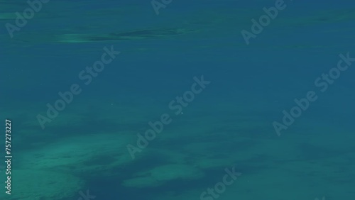 Wallpaper Mural Camera moving forwards diving underwater and rising above its level, moving towards coastal rocky shore Torontodigital.ca