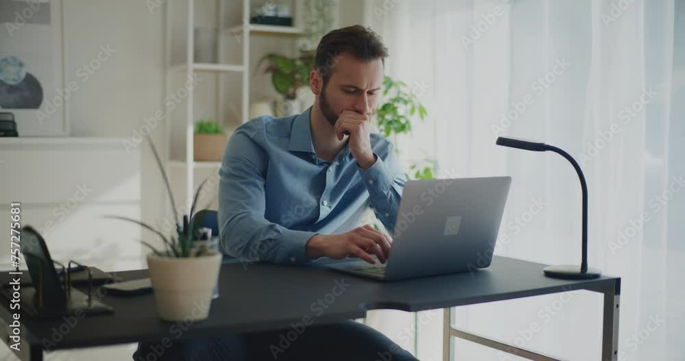 Determined male professional typing while using laptop Determined male professional typing while using laptop