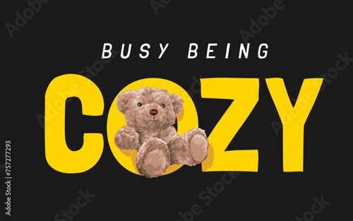 cozy slogan with bear doll sitting in o letter hand drawn vector illustration on black background