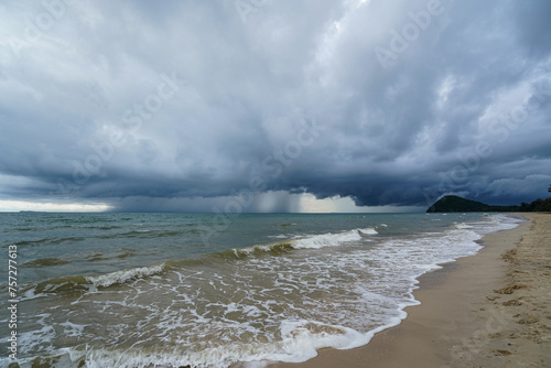 A rainstorm was brewing at sea, blowing him towards the shore. © Photo Gallery
