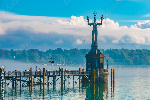 Nice close-up view of the famous Imperia statue with the pier at the harbour entrance of Constance (Konstanz) by Lake Constance (Bodensee) in Germany. 