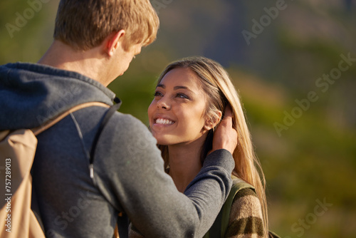 Couple, smile or romance in hiking, vacation as walking adventure in nature park in countryside. Happy woman, man or love as sunshine, date or bonding together on trekking holiday or day trip