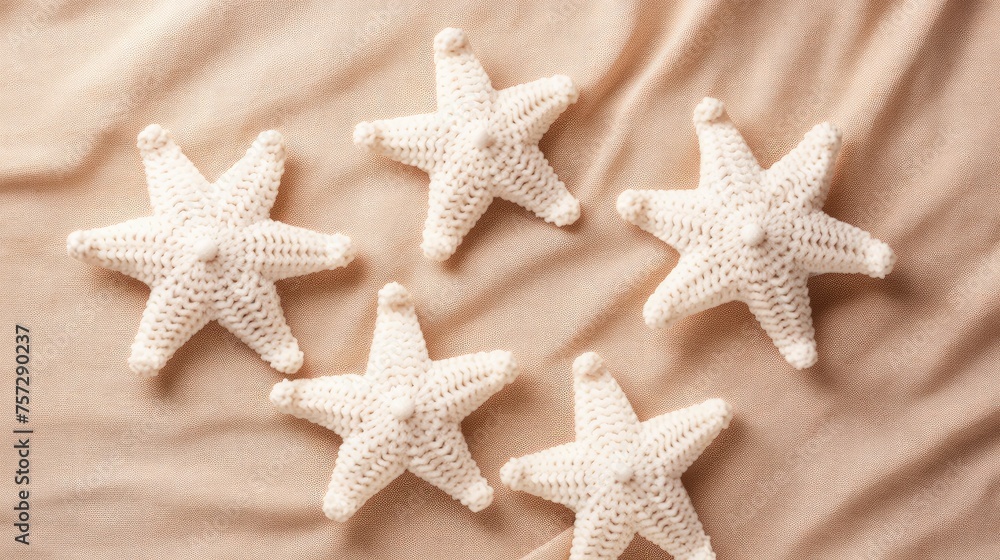 Knitted stars on a monochrome colored background, top view, with space for text. Greeting card, hobby, knitting, children's toy. Knitted stars on a monochrome colored background, top view, with space for text. Greeting card, hobby, knitting, children's toy.
