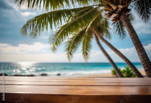 Top of wood table with seascape and palm tree, blur bokeh light of calm sea and sky at tropical beach background