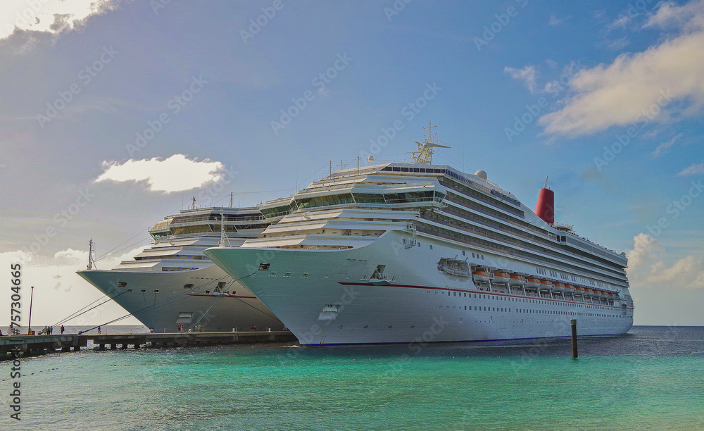 Family Caribbean cruising to tropical white sandy beaches islands paradise with modern cruiseship cruise ship liner, palm trees and turqouise water