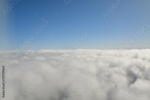 Carpet of clouds from above sky travel jet