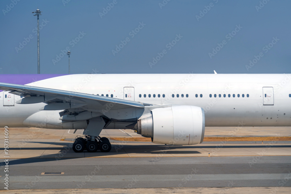Fototapeta premium View of the fuselage of the aircraft and many windows, wing landing gear