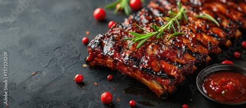 BBQ Rib on wooden cutting board top view. Rack of barbecued pork ribs with sauce. web banner with Copy space for text.