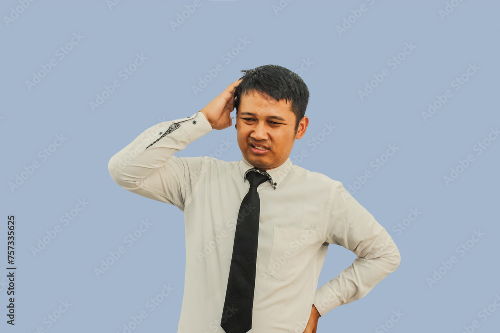 Adult Asian man showing confused expression Adult Asian man showing confused expression