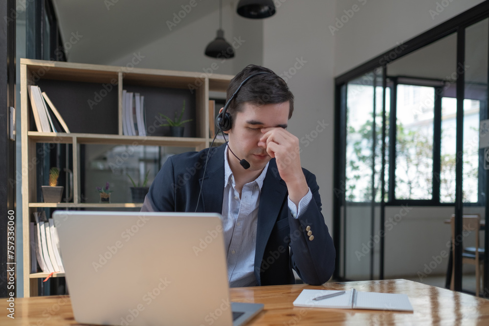 Headache, stress and tired business man at laptop in office for anxiety. Burnout, fatigue and worker at computer with pain, worried middle aged man at laptop suffering from stress indoor Headache, stress and tired business man at laptop in office for anxiety. Burnout, fatigue and worker at computer with pain, worried middle aged man at laptop suffering from stress indoor