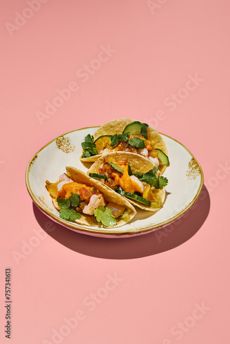 Gluten-free tacos with sweet potato mousse and turkey on a vintage plate with pink background