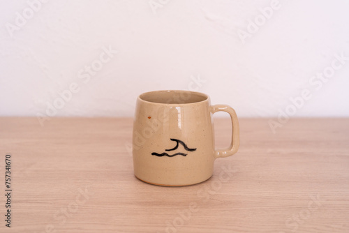 Handmade ceramic mug with sea drawing. High quality photo