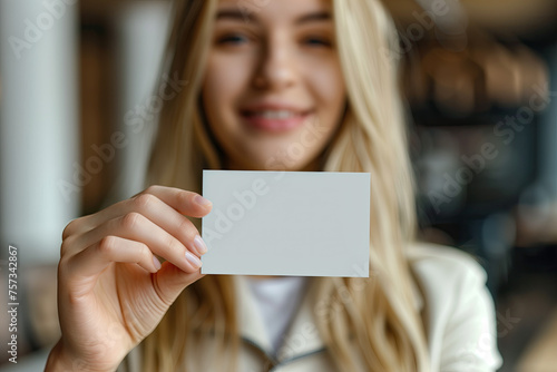 woman holding a blank card