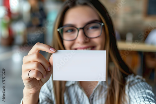 optician woman holding blank card