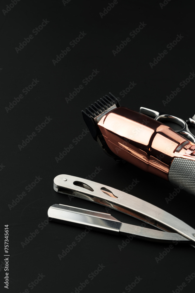 Tools for barbershop on black background studio shot Tools for barbershop on black background studio shot